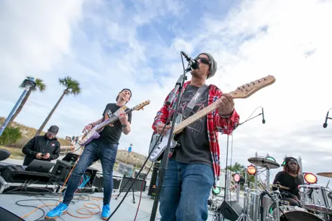 Brett playing bass at a Holiday festival on Tybee!