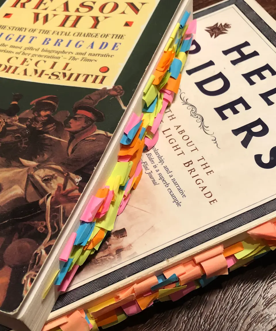 Two books used as resources for this episode, filled with sticky-tab page markers