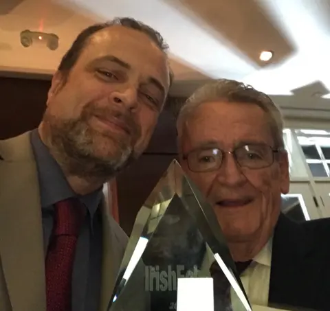 CenterPieceNY guest Adrian Flannelly receives Irish Presidential Distinguished Service Award.