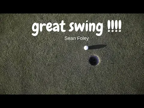 Practicing His golf swing