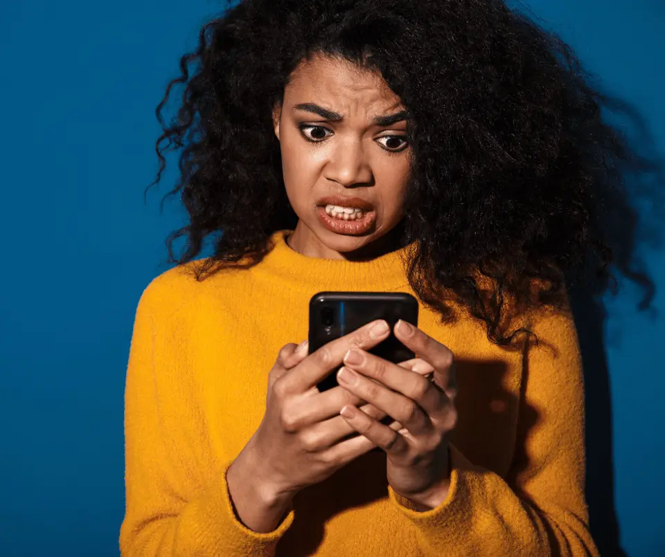 Confused Person Looking at Phone