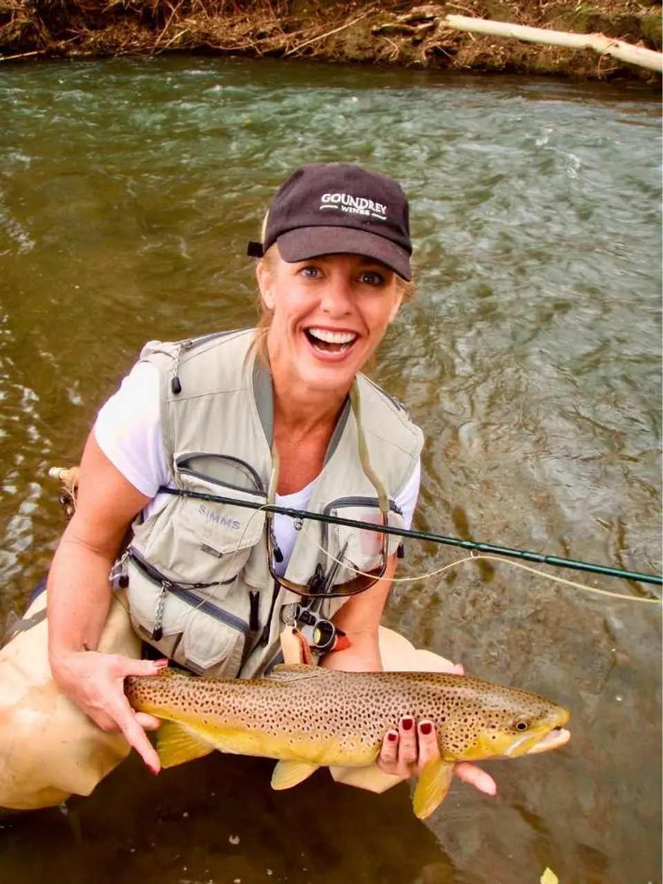 Catherine Smith with her 24" brown trout from the Iowa Driftless