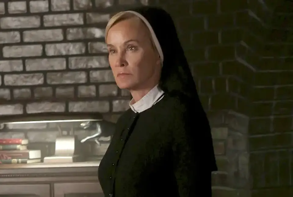 american-horror-story-jessica-lange-sister-jude.webp Sister Jude Martin presiding over the cold, oppressive institutional halls of Briarcliff Manor in American Horror Story: Asylum (Season 2).