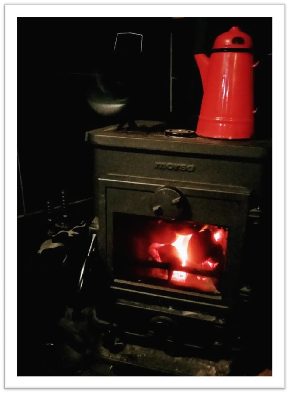 Stove glowing red. Red pot